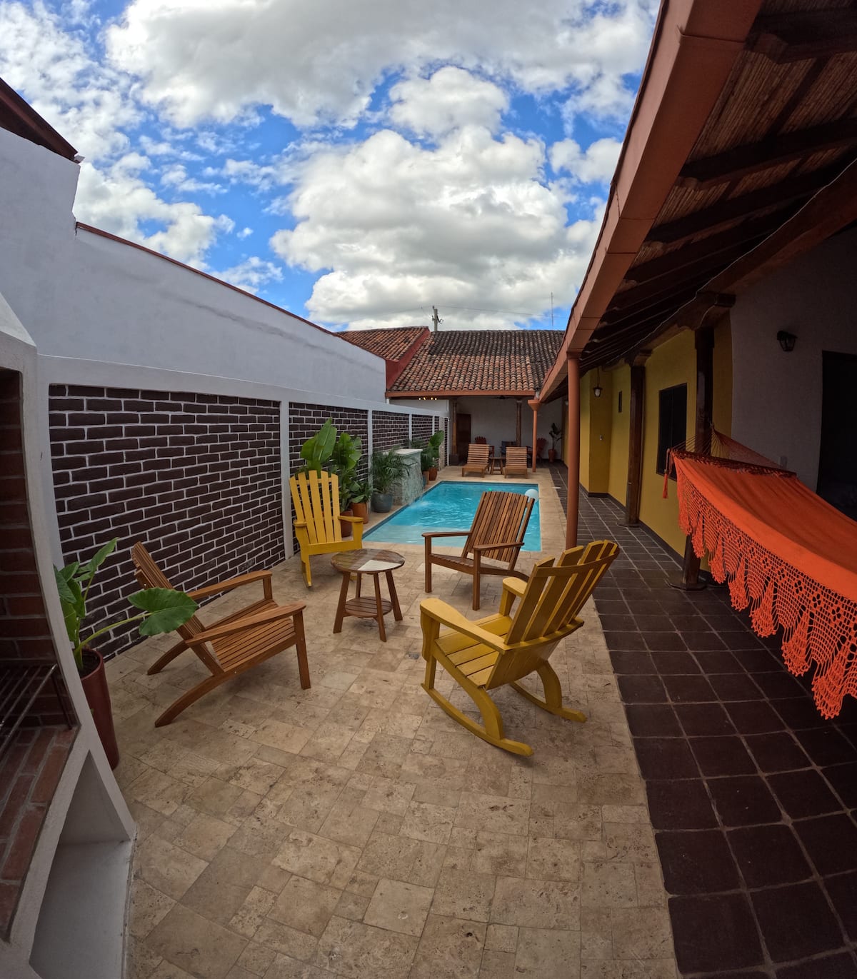 Apartment Two — pool, loungers and a hammock